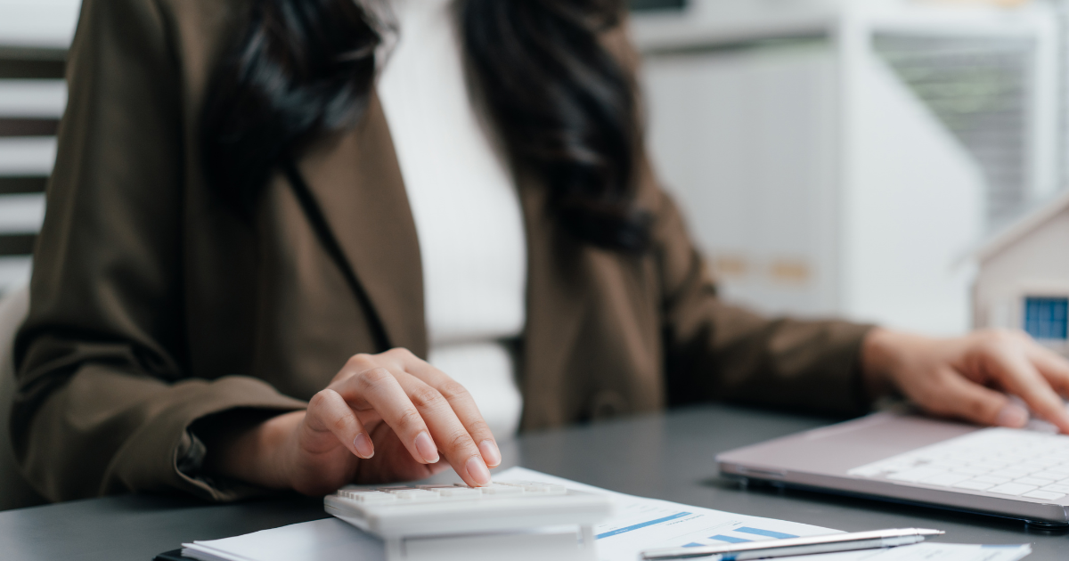 woman looking through finance documents